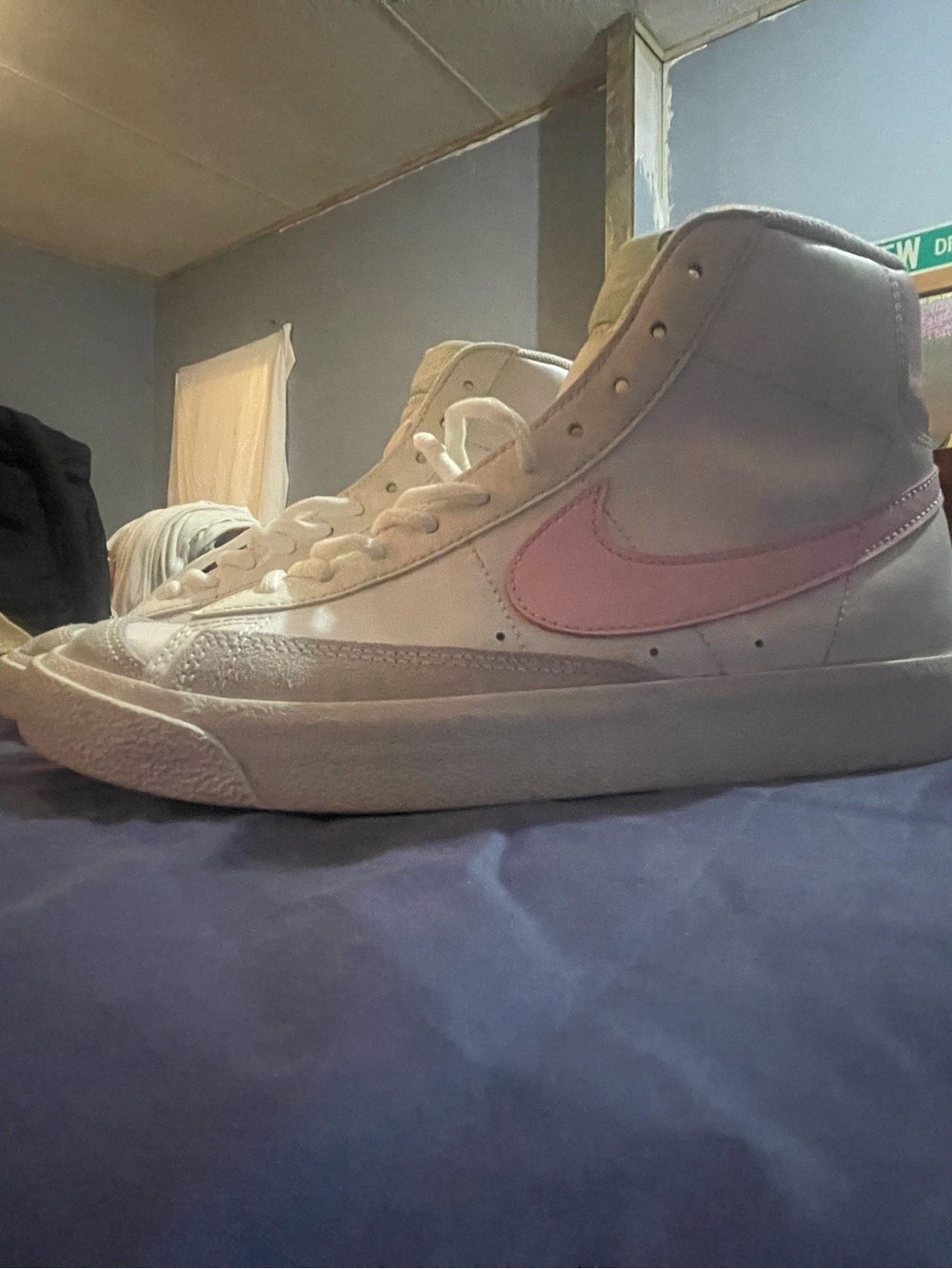 Nike Women's High-Top Sneakers in White with Pink Swoosh
